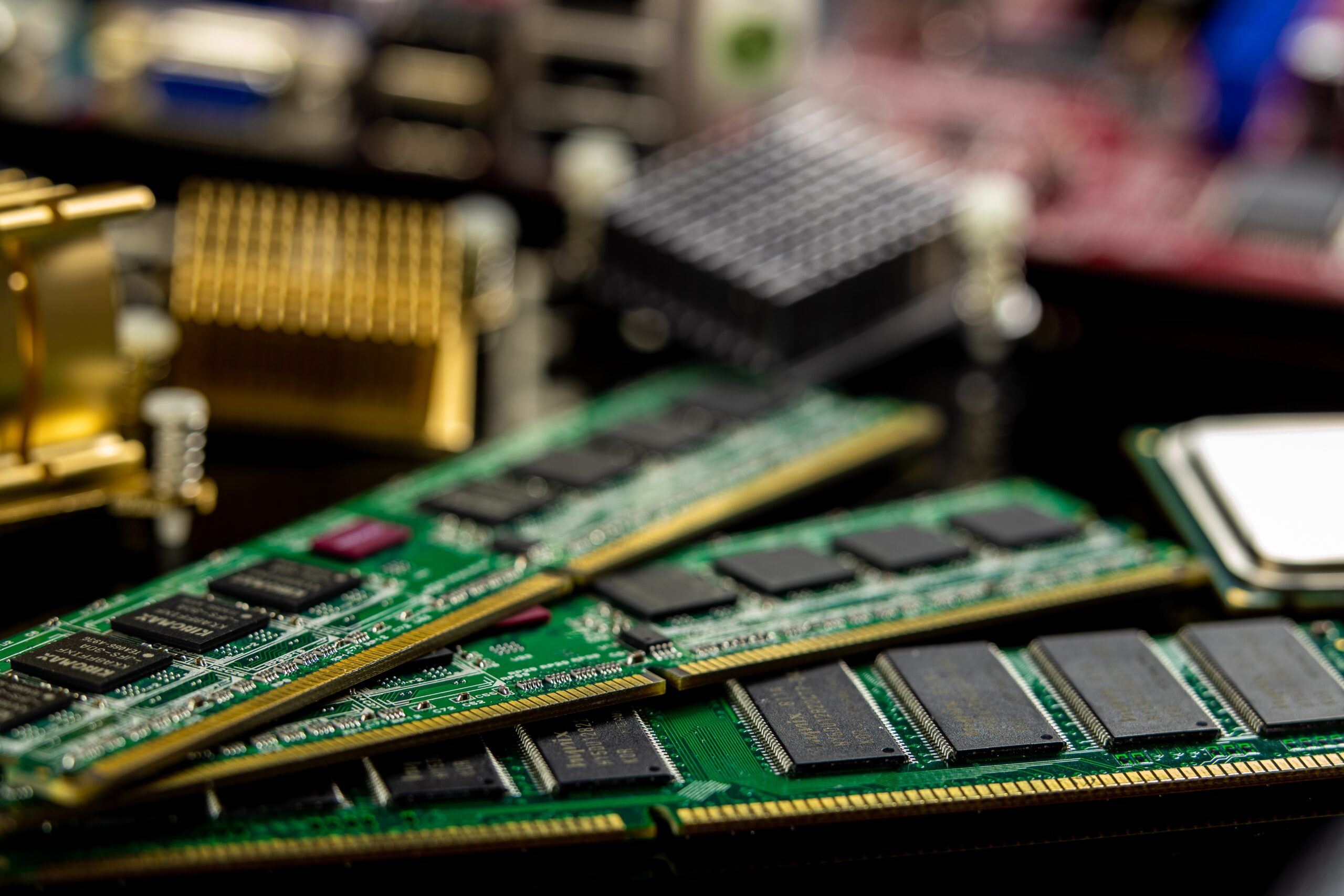 Image of Ram and other computer components in the background.